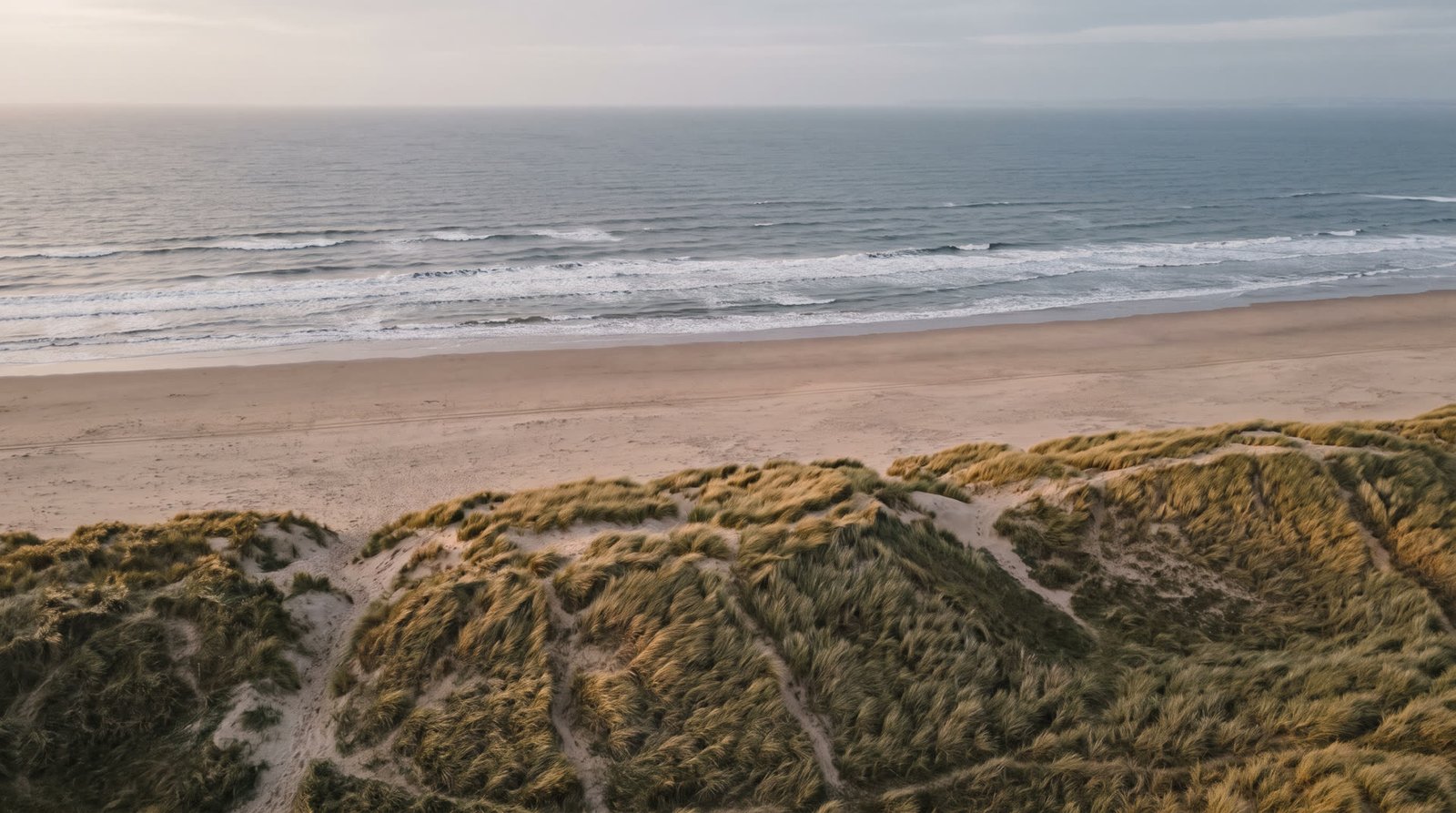 Rolling dunes and empty beach on the Wirral shore