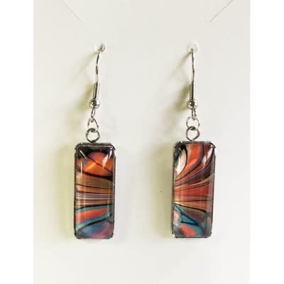 The actual earrings — orange and teal fluid art rectangles